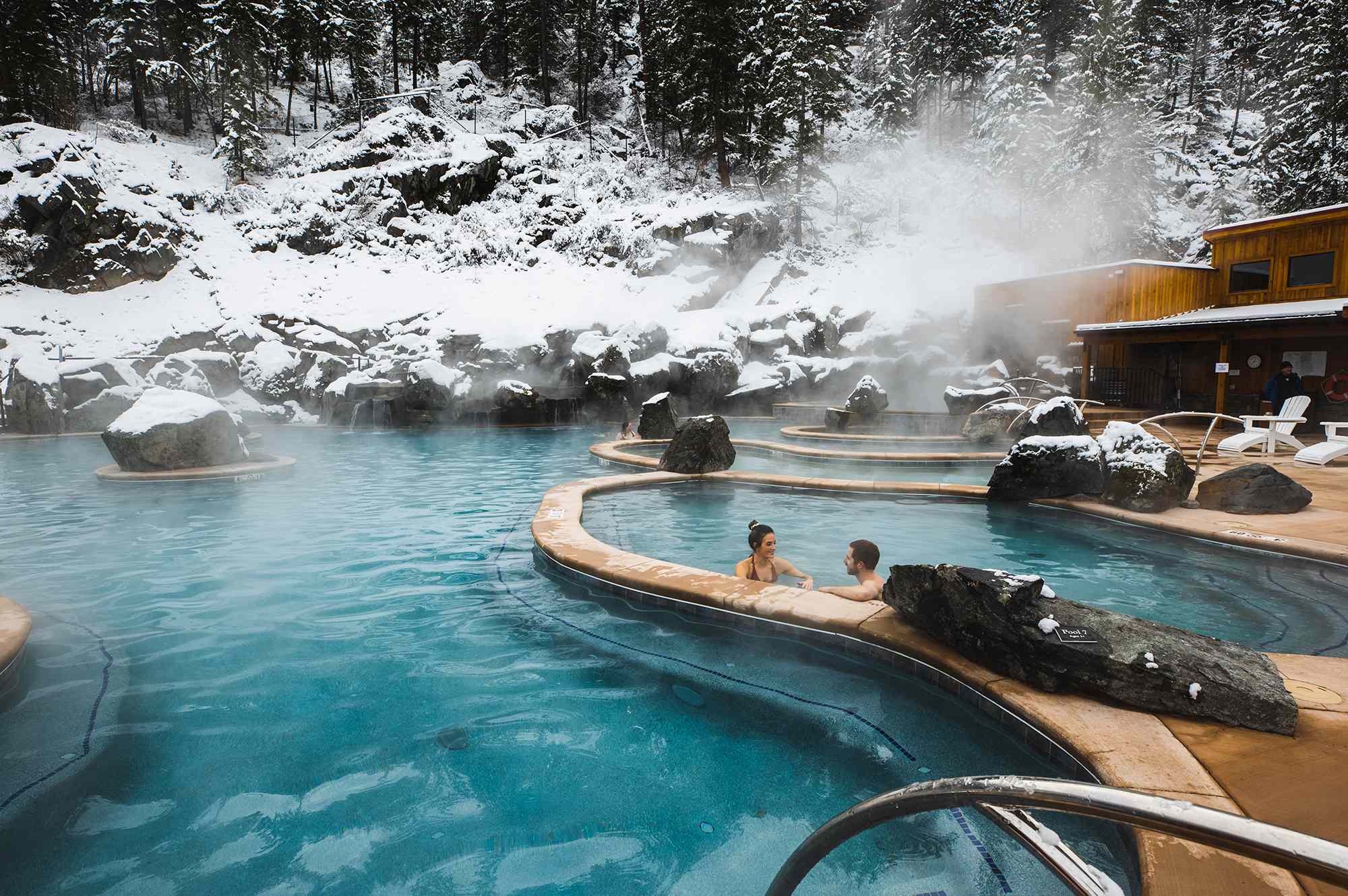 This Historic Montana Hot Springs Resort Offers Mountain Views and Riverside Pools