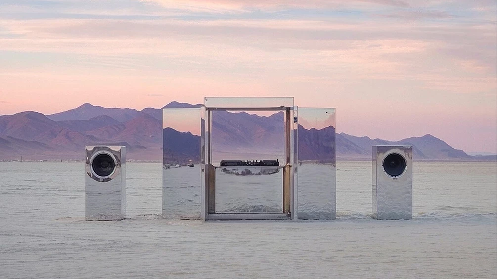 This mirrored DJ booth is designed to disappear into its surroundings