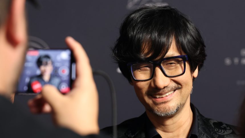 Hideo Kojima Wears Joy Division T-Shirt to Sony Visit, Sparking Johnny Silverhand Arasaka Tower Comparison